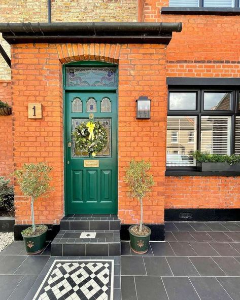 12 Best Paint Colors Perfect for Red Brick Exteriors Homes With Red Brick, Brick House Trim, Green Glass Door, Brick Exteriors, Green Front Door, Red Brick Exteriors, Welcoming Entryway, Victorian Renovation, Green Front Doors