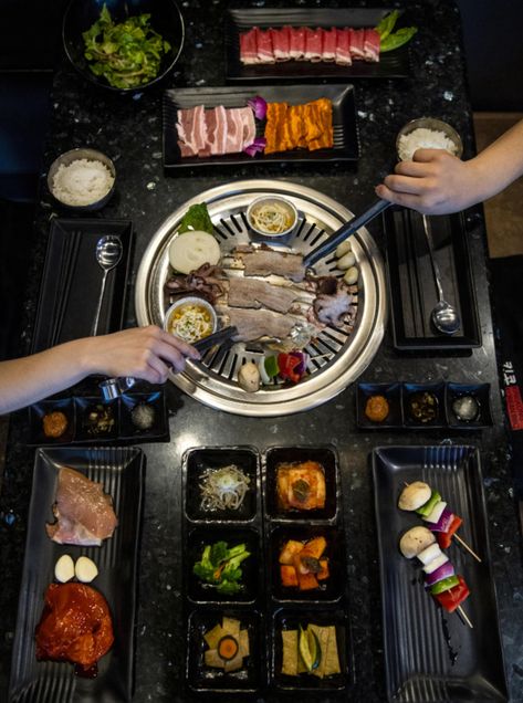 Pork belly, baby octopus, corn and veggie skewers are placed on the grill to cook at KingKong Korean BBQ in Vancouver. Alisha Jucevic/The Columbian Oven Baked Corn, Mongolian Grill, Teriyaki Chicken Skewers, Veggie Skewers, Korean Barbecue, Baked Corn, Baby Octopus, Bulgogi Beef, Marinated Beef