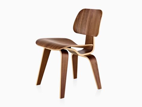 Eames Molded Plywood Chair with a medium finish and wood legs, viewed from a 45-degree angle. Molded Plywood Chair, Brisbane Apartment, Famous Chairs, Eames Furniture, Eames Dining Chair, Client Brief, Dining Chair Wood, Air Chair, Herman Miller Eames