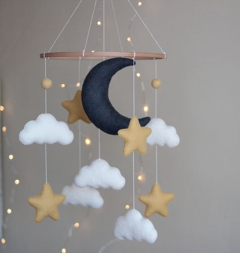 Hanging felt mobile with moon ,  stars and clouds . Best present for your new child or for a baby shower.The parts could be changed and a completely new one can be added. All toys are specially designed and handmade for bringing color and tenderness to the Baby's Room. Made with eco-friendly polyester felt and wool blend felt of the highest quality.Individual design is possible.  You can request your preferred palette color if item doesn't match your nursery. Just ask me if you want to change an Moon Crib, Moon Stars Nursery, Star Themed Nursery, Stars Baby Mobile, Baby Mobile Felt, Diy Baby Mobile, Mobile Crib, Moon Nursery, Star Mobile