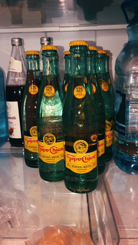 topo chico in a glass bottle slaps Topo Chico Aesthetic, Drinks With Topo Chico, Poppi Soda Aesthetic, Blue Soda Aesthetic, Holding Beer Bottle Aesthetic, Glass Soda Bottles Aesthetic, Chicos Aesthetic, Pool Fashion, Party Drinks