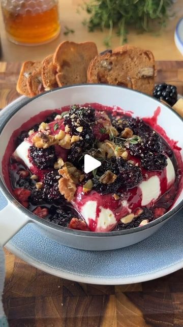 Tanya Yafe Aknin on Instagram: "Jammy Baked Goat Cheese with Blackberry Sangria Jam by @frohneats will be on repeat this summer! 🤤 It’s insanely delicious, so simple to make, and the great part is that you can whip it up in less than 20 minutes making it the perfect summer appetizer! 🤌

Share this with someone you would smash this with! 🫠

**Ingredients:**
- 1 cup Blackberries
- 3 oz Sugar
- 1/2 cup Red Wine 
- 1 oz Brandy
- Zest of 1 Orange
- Flaky Salt
- 1 Goat Cheese Log
- 1/4 cup Chopped Walnuts
- Pinch of Fresh Thyme 

**Instructions:**
1. Add blackberries, sugar, red wine, brandy, orange zest, and flaky salt to a pot and simmer on high until the jam is reduced and registers 220°F on a thermometer. Reserve.
2. Add goat cheese to a baking dish, spoon over jam, and top with walnuts a Jammy Baked Goat Cheese With Blackberry, Goat Cheese And Blackberry, Jammy Baked Goat Cheese, Goat Cheese Recipes Appetizers, Goat Cheese Log, Blackberry Sangria, Baked Appetizers, Goat Cheese Dip, Cheese Dips