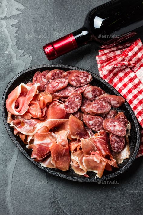 Spanish ham serrano, salami and bottle of red wine on slate by lblinova. Spanish ham serrano, salami and bottle of red wine on slate background, top view #Sponsored #salami, #bottle, #red, #Spanish Spanish Ham, Top View, Red Wine, Steak, Cool Designs, Meat, Wine, Chicken, Red