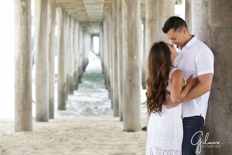 HB engagement session under the pier in Orange County, white dress, engaged, surf, Huntington Beach, CA gilmorestudios.com Engagement Pictures Beach, Country Engagement Pictures, Engagement Beach, Couples Beach Photography, Huntington Beach Pier, Couple Beach Pictures, Vacation 2024, Beach Photo Session, Engagement Photos Country