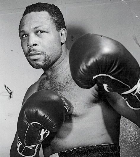 The one and only “Old Mongoose”, Archie Moore. His record of 185-23-10 (131) boasts the most knockouts by any single fighter in boxing history, and made his debut in 1935 before his eventual retirement, 28 years later, in 1963. In his final 30 fights – when he was closing in on his 50th year – the only man he didn’t beat was a young Cassius Clay (before he changed his name to Muhammad Ali). Moore was already well past his best, he drew future world light-heavyweight champion Willie Pastrano Archie Moore Boxer, Archie Moore, Joe Louis, Boxing Images, Boxing History, Volunteer Firefighter, Health Trends, Jack Johnson, Recent News