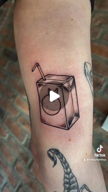 Martha Craig on Instagram: "Orange juice for Keegan! :)  . . . #tattoo#juiceboxtattoo#oakvilletattoos#torontotattoos#illustrativetattoos#cutetattoos#blackandgreytattoos" Orange Juice Tattoo, Juice Box Tattoo, Tattoo Ideas For Couples, Box Tattoo, 2023 Tattoo, Juice Tattoo, Olive Juice, Juice Box, Juice Boxes