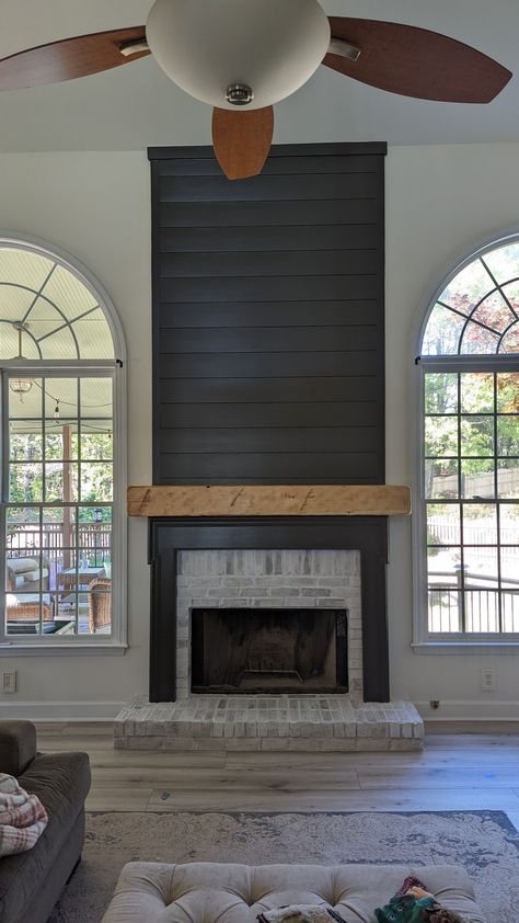 Updated with shiplap and white wash bricks Brick Fireplace With Black Shiplap, Shiplap Fireplace With Brick, Tall Accent Wall, Brick And Shiplap Fireplace, Brick And Shiplap, Black Brick Fireplace, Apartment Industrial, Black Shiplap, Fireplace Update