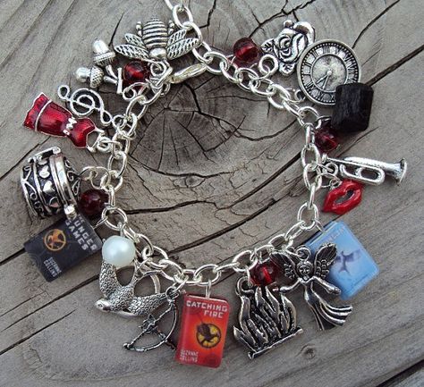 Love. Too bad it $50..... Hunger Games Bracelet, Hunger Games Jewelry, Mockingjay Pin, Hunger Games Fandom, The Bling Ring, Computer Shortcuts, Hunger Games 3, Hunger Games Series, Hunger Games Catching Fire