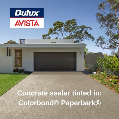 Did you know you can match your concrete driveway to your steel roof or fence – while sealing the concrete for lasting good looks? Dulux Avista now offers four Colorbond® Sealer Tints. Choose from bold and trendy Monument®, timeless Woodland Grey® or the coastal vibes of Shale Grey™ and Paperbark®. Sealers are essential to keep concrete looking good for longer, but why not add some serious style at the same time? This is a fast, affordable way to create a cohesive look for your home's exterior. Plain Concrete Driveway, Driveway Paint Colors, Coloured Concrete Driveway, Concrete Driveway Sealer, Driveway Paint, Aggregate Driveway, Colorbond Roof, Cement Render, Concrete Floor Coatings