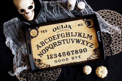 DIY: Ouija Board Serving Tray – Melodrama Party Main Table Decor, Diy Ouija Board, Spooky Dinner, Halloween Party Planning, Dinner Centerpieces, Halloween Party Table, Skull Candle Holder, Halloween Tablecloth, Main Table