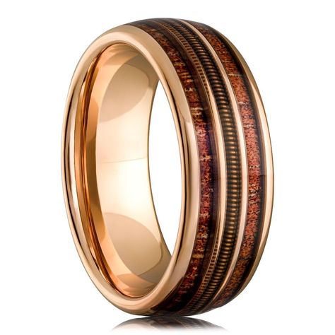 PRICES MAY VARY. Unique Design: The Guitar String Whiskey Barrel Men's Wedding Ring features a striking rose gold and tungsten blend with a genuine whiskey barrel wood inlay and an intricately woven guitar string, making it a unique and meaningful symbol of your love for music. Recycled Materials: Crafted with sustainability in mind, this ring showcases a blend of recycled materials, making it an eco-friendly choice. Durable and Scratch-Resistant: Made from robust black tungsten, this ring is de Wooden Mens Wedding Bands, Tungsten Men’s Wedding Band, Men’s Gold Band, Groom Ring Wedding, Men’s Engagement Rings, Mens Unique Wedding Bands, Whiskey Barrel Rings, Male Wedding Rings, Unique Mens Wedding Bands