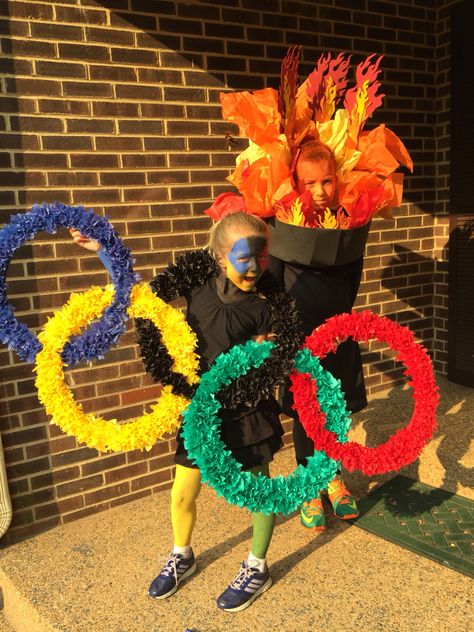 DYI Olympic costumes Olympic Day Activities, Olympics Halloween Costume, Olympics Themed Parade Float, Olympic Float Ideas, Olympic Halloween Costume Ideas, Olympic Athlete Costume, Olympic Shirts Ideas, Olympics Trunk Or Treat, Olympic Trunk Or Treat