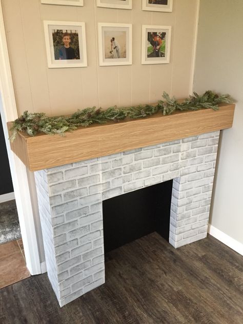 DIY fireplace from cardboard Diy Fireplace Cardboard, Fireplace Diy Cardboard, Faux Fireplace Diy Cardboard, Mantle Decor Diy, Cardboard Arcade, Faux Fireplaces, Diy Christmas Fireplace, Photoshoot Set, Cardboard Fireplace