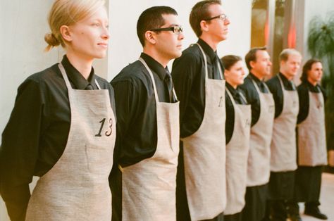 The waiters wore table numbers on their apron and led guests to their table which created a unique and interactive way to find your seat! #weddingwednesday #seating #tablenumbers #weddings #reception #events #chicago #pwe Wedding Waiters, Restaurant Clothes Staff, Resturant Ideas Uniform, Restaurant Staff Uniform, Waiter Uniform Design Restaurants, Fine Dining Waiter Uniform, Waiter Uniform, Staff Uniforms, Hospitality Uniform