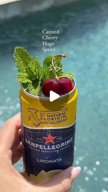 Julianna McIntosh on Instagram: "Canned cocktails? Or CANNED COCKTAILS !! Canned Cherry Hugo Spritz for our first official cocktail recipe of Cherry Week 2024 🍒

Using the draft top screw top to make this can a perfect drinking vessel, meant to be sipped poolside! It’s also just such a cute way to level up your presentation… your guests will love it and so will you, yay to no broken glasses this summer!

Ingredients:
* 3-4 Sprigs fresh mint
* 1 oz San Pelligrino Limonata
* 3/4 oz Cherry Infused Elderflower Liqueur
* 3 oz Prosecco
* Ice
Instructions:
1. Use a draft top to pop off the top of your Pellegrino Limonata soda or sparkling water can!
2. Pour out the liquid but reserve 1 oz of the bubbles.
3. Smack & add in 3-4 sprigs of fresh mint.
4. Add in 3/4 oz cherry-infused elderflower liqu San Pellegrino Cocktails, Summer Ingredients, Hugo Spritz, Canned Cocktails, Canned Cherries, Drinking Vessels, San Pellegrino, Sparkling Water, Fresh Mint