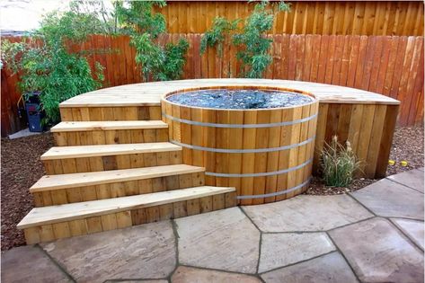 wood barrel hot tub design with deck surround to make it easier to get in and out of the hot tub. The wooden hot tub design is rustic and creates a relaxing atmosphere. #hottub #woodenhottub #backyardspa Round Hot Tub, Hot Tub Landscaping, Cedar Hot Tub, Hot Tub Designs, Outdoor Hot Tub, Soaking Tubs, Japanese Soaking Tubs, Hot Tub Deck, In Ground Spa