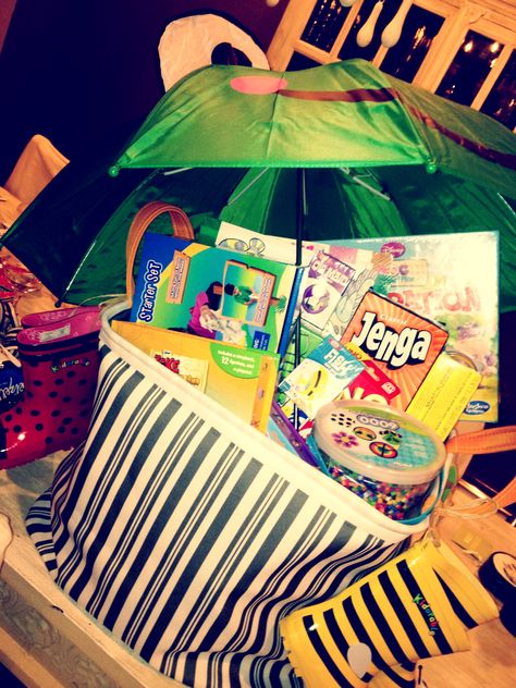 Rainy day basket!  rainboots, operation, jenga, stickers, puzzles, perler beads, busy books, kinetic sand, etc Rainy Day Auction Basket Ideas, Rainy Day Basket, Holiday Raffle, Long Basket, Silent Auction Basket, Game Basket, Rainy Day Games, Art Auction Projects, Theme Baskets