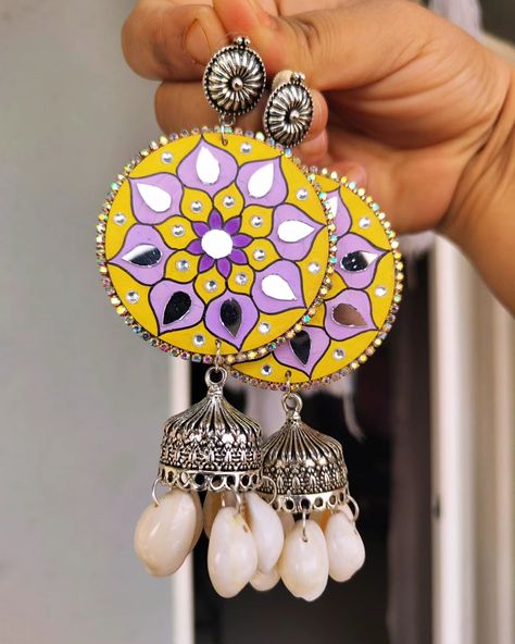 Mandala Handmade earrings in shade of yellow & purple 💛 💜 The best thing about these earrings is that they are lightweight & water-resistant 🤗 DM to order or to get customise 🫶 #handmade #handpainted #handpaintedearrings #earrings #lotusearrings #lotus #earringsoftheday #earringsofinstagram #handmadeearrings #mandala #homedecor #earringideas Diy Indian Earrings, Diy Elegant Earrings, Simple Earing, Mdf Earrings, Mandala Paint, Jewellery Tutorial, Painted Jewellery, Shade Of Yellow, Bamboo Jewelry