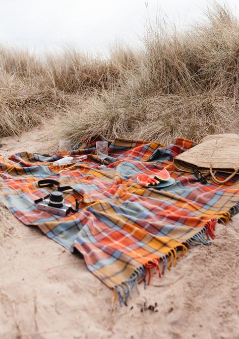 Picnic Carrier included. Choose your strap colour above.This TBCo Picnic Blanket with fringe is woven from 70% recycled wool and 30% mixed recycled fibres. On average, each blanket saves six garments from landfill, turning preloved into reloved. Recycling wool can be a challenge as the fibres can be too short to respin. Our solution is to blend recycled wool with longer mixed fibres saved from landfill to create a soft and durable yarn, which is woven in a dense twill weave and brushed for textu Fabric Shoot, Blanket Photography, Blanket With Fringe, Tartan Blanket, Sleep Accessories, Cashmere Blanket, Pajamas Gift, Baby Gift Box, Triangle Scarf