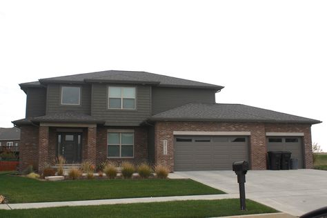 Mastic Misty Shadow dark siding and dark shakes in Normal IL Misty Shadow Siding, Dark Green Siding, Brown Brick House Exterior, Siding Combinations, Dark Grey Siding, Brown Brick Exterior, Dark Siding, Brown House Exterior, Grey Brick Houses