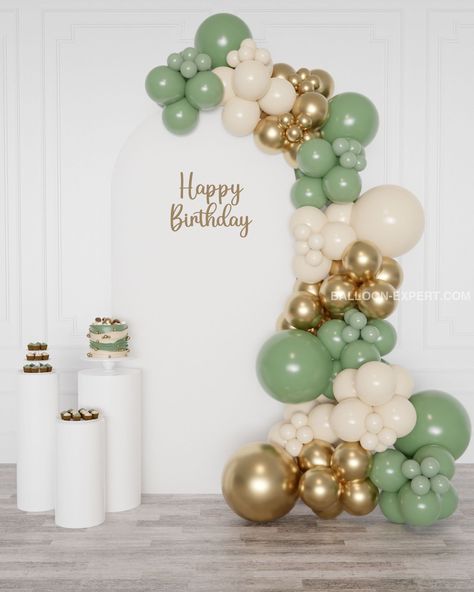 This balloon garland features a palette of sage green, ivory, and chrome gold latex balloons. The decor is perfect for baby showers, birthdays, weddings, and special occasions. Balloon Decorations Green And Gold, Sage Green Gold And White Balloon Decor, Sage And White Balloon Garland, Sage And Gold Party, Sage Green Balloon Decorations, Sage Decorations Party, Sage Green And White Party Decor, Green Gold And Cream Party Decor, Green Themed Birthday Party Decorations