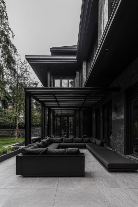 Design a cozy outdoor space with sleek and modern black accents. Black And Wood Backyard, Modern Black House Exterior, Black Grunge Aesthetic, Black Mansion, Modern Black House, Pretty Houses, Terrace Ideas, Dark Modern, Beach House Exterior