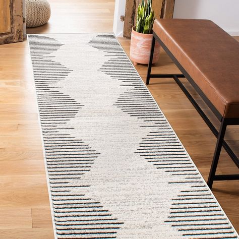 Unroll this modern geometric stripe design rug in any area of your home for a chic and stylish color scheme. With bold colors and different size options, this rug will masterfully elevate your living space. Scandinavian Hallway Rug, Area Rug Runner Placement, Runner Rug Between Beds, Kitchen Runner Rug Uk, Trendy Runner Rugs, Doors On Runners, Scandi Runner Rug, Runner Rug On Tile, Office Rug Runner