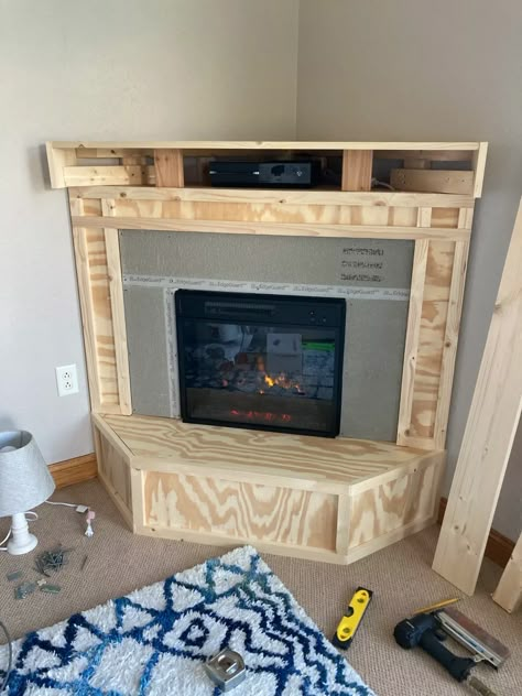 How to Build a Corner Fireplace for Under $300 - Dengarden Corner Fireplace And Tv Wall Ideas, Corner Built In Fireplace, Build A Corner Fireplace, Corner Tv Stand With Fireplace, Diy Corner Tv Stand, Diy Corner Fireplace, Bedroom Fireplaces, Corner Fireplace Tv Stand, Faux Fireplaces