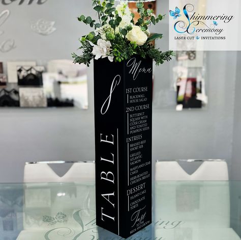 This elegant Black and White table number & Menu flower centerpiece box is the perfect way to bring a classic beauty and function to your event. Boxes arrive flat with a single pre-adhered peel & stick tape.  Tape is permanent, box cannot be re-folded after assembly Includes a support topper to hold flowers, flower foam, or other item.  This support topper can be placed slightly below the top for floral placement or placed at the top and covered with the included card stock lid covering.  We rec Flower Box Centerpiece Diy, Wedding Centerpieces Fir Round Tables, Modern Centerpieces Wedding Round Table, Banquet Set Up Ideas, Black And White Cocktail Table Decor, Black On Black Tablescape, Black Vase With Flowers Centerpieces, Black White Gold Silver Party Centerpieces, Banquet Decorations Elegant