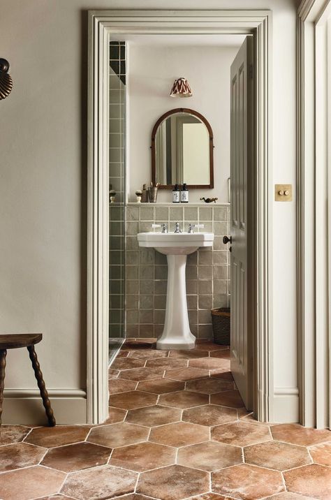 See the medditeranian inspired terracotta effect floor tiles complemented seemlessly by delicate mossy green bathroom tiles Bathroom Terracotta Floor, Terracotta Bathroom Tiles, Willow Square, Terracotta Bathroom, Tile Terracotta, Yellow Painted Walls, Terracotta Floor Tiles, Hexagonal Tiles, Wet Room Flooring