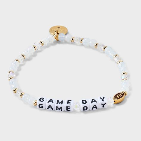 Tagline: All fun and games Description: Get your game face on and your wrist ready with our exclusive "Game Day" bracelet from Little Words Project® featuring a custom football casted bead. This sporty accessory is a great way to celebrate your love of the game and keep a winning attitude all day long. This Little Word™is more than just a bracelet. It’s your key to inspiring a kinder world. Wear your word as long as you need it. When you’re ready, pass it on to someone else who needs it more. Ea Game Day Bracelets, Bead Bracelet Ideas Words, Bead Bracelet Words Ideas Bad, Falcon Jewelry, Little Words Project Bracelets, Little Words Project, Bracelet Stuff, Football Jewelry, Football Bracelet