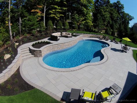 Landscape by Triad Associates, Inc. Pools With Retaining Walls Sloped Backyard, Pool Retaining Wall, Simple Pool, Pool Pavers, Luxurious Pool, Water Feature Wall, Freeform Pools, Swimming Pool Landscaping, Sloped Backyard