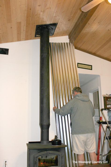 how to install a corrugated tin wall - The Weekend Country Girl featured on @Remodelaholic Wood Stove Heat Shield, Wood Stove Decor, Wood Burning Stove Corner, Corner Wood Stove, Wood Stove Surround, Wood Stove Installation, Wood Stove Chimney, Stove Decor, Wood Stove Hearth