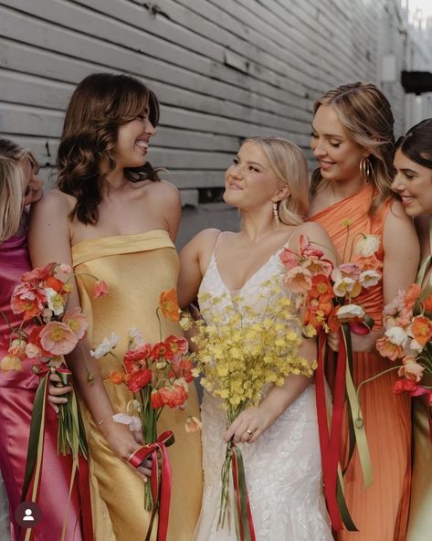 Colorful Flowers Bridesmaid, Mismatch Orange Bridesmaids, Wedding Party Sunset Colors, Bold Color Bridesmaid Dresses, Sunset Colour Bridesmaid Dresses, Pink Yellow Orange Bridesmaid Dresses, Summer Wildflower Wedding Bridesmaid, Pink Orange Yellow Bridesmaid Dresses, Pastel Sunset Bridesmaid Dresses