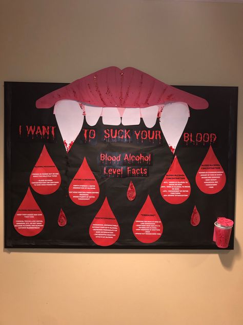 Bulletin Board that reads “I want to suck your blood” with vampire fangs. Underneath it reads “blood alcohol level facts” each blood drop has information on it. Phlebotomy Door Decorations, Vampire Bulletin Board, Ra Halloween Programs, Alcohol Ra Bulletin Boards, October Ra Bulletin Board Ideas, Ra Alcohol Bulletin Boards, Halloween Bulletin Board Ideas For Work, Halloween Ra Board Ideas, Halloween Door Decs Ra