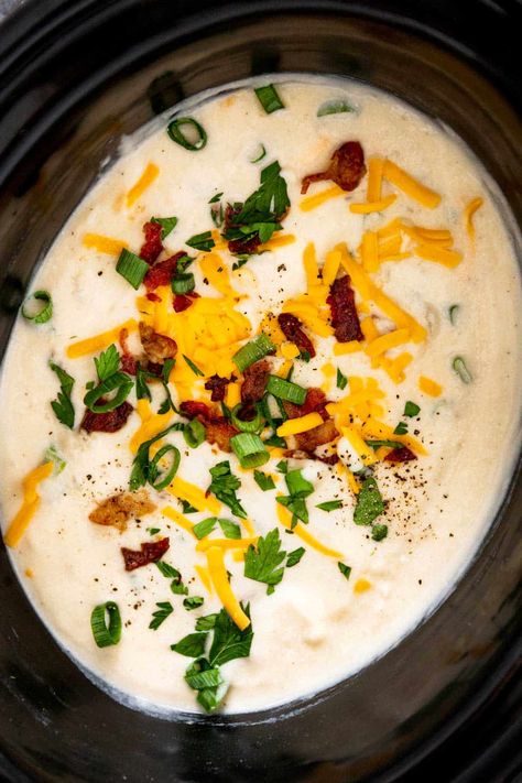 This one-pot creamy cheddar bacon potato soup, brimming with crispy bacon, cheddar cheese, and potatoes, offers an easy dinner option that's sure to please everyone's palate. Using a slow cooker, this creamy soup becomes the epitome of ultimate comfort food—simply set it and let it do its magic. Cheddar Bacon Potato Soup, Bacon Potato Soup, Potato Soup Crockpot Recipes, Potato Soup Crock Pot Easy, Crockpot Potato Soup, Slow Cooker Potato, Crockpot Potato, Potato Bacon Soup, Slow Cooker Potato Soup