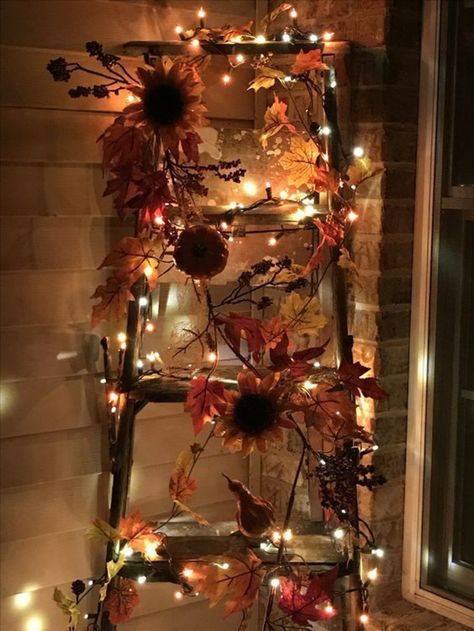 A ladder adorned with fairy lights looks wonderful on an Autumn night Christmas Decorations For Front Porch, Thanksgiving Porch Decorations, Decor Porch Ideas, Picket Fence Decor, Thanksgiving Porch, Porch Ideas Christmas, Decoracion Halloween, Dollar Tree Pumpkins, Fall Decor Diy Crafts