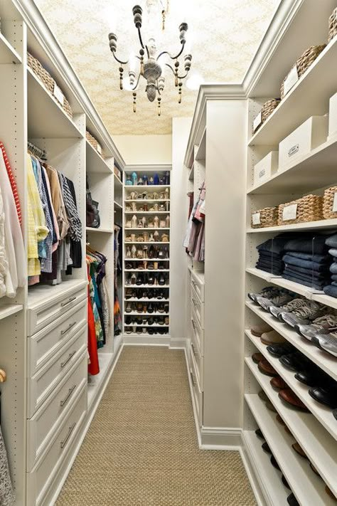 Superb closet features built-in shelves used to hold baskets, jeans separated with acrylic dividers and shoes. Narrow Walk In Closet, Wallpapered Ceiling, Closet Chandelier, Closet Wallpaper, Narrow Closet, Shelves Closet, Closet Master, Glam Closet, Master Closet Design