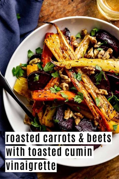 This 10-ingredient roasted beet and carrot side dish packs some serious flavor! The roasted root vegetables get drizzled with a toasted cumin vinaigrette that's made with shallot and maple syrup. The dish gets finished with fresh parsley and walnuts for a crunchy, nutty finish. This recipe is vegan, gluten-free, and grain-free. Carrot Side Dish, Roasted Beets Recipe, Beets And Carrots, Roasted Beets And Carrots, Roasted Carrots And Parsnips, Carrots Side Dish, Roasted Carrots Recipe, Autumn Side Dishes, Roasted Root Vegetables