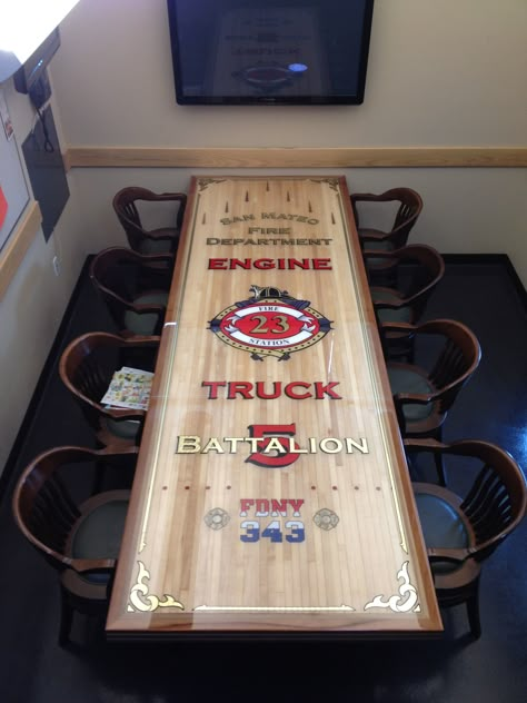 A re-cycled bowling alley made into our firehouse dinner table. A lot of work, but it came out AWESOME! Firehouse Decor Ideas, Firefighter Tables, Fire House Decor, Built In Dining Room Seating, Firefighter Bar, Firefighter Decorations, Recreation Room Ideas, Fire Hose Projects, Fire Dept Decor