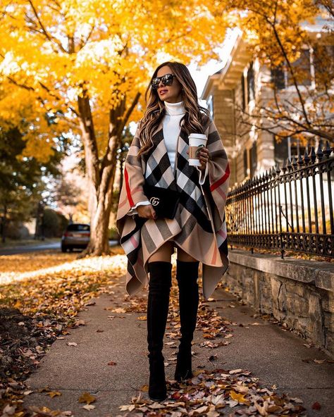 Fashion blogger mia mia mine wears a burberry plaid poncho over a sweater dress and over the knee boots for fall. To see more chic burberry outfits, how to wear a poncho, or sweater dress and boots, click through to my blog. #falloutfits #burberry #otkboots Burberry Outfits, Burberry Poncho, Layering Outfits Fall, Rome Fashion, Mia Mia Mine, Mia Mia, Burberry Plaid, Ways To Wear A Scarf, Estilo Chic