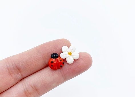 PhoYoSelf on Instagram: “Mixmatched earrings - ladybug and flower 🐞 🌸 #polymerclay #polymerclayearrings #polymerclayjewelry #polymerclayladybug #ladybugearrings…” Clay Cute, Clay Earring, Bungalow House, Bungalow House Design, Polymer Clay Jewelry, Polymer Clay Earrings, Clay Earrings, Bungalow, Polymer Clay