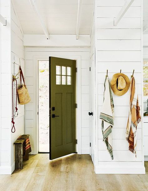 Functional Entryway Ideas, Cottage Foyer, Light Wood Flooring, Cottage Entryway, Functional Entryway, Green Front Doors, White Wainscoting, White Molding, Large Hallway