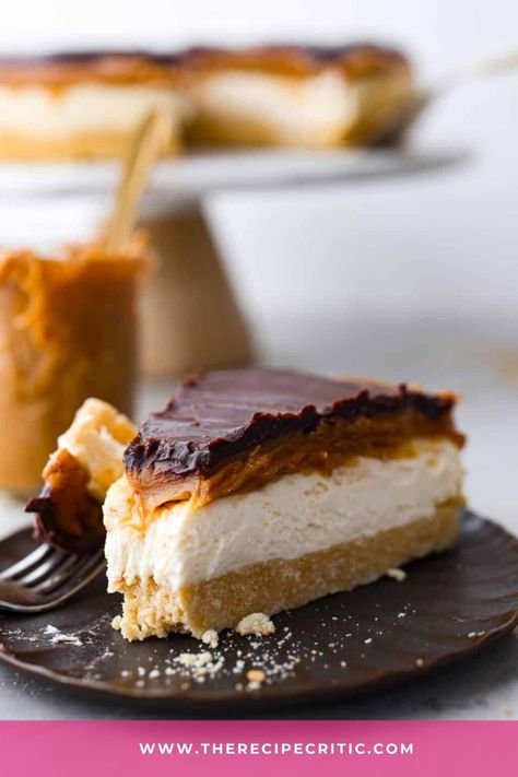 This Millionaire Cheesecake recipe features a velvety cream cheese filling sitting on a melt-in-your-mouth shortbread crust topped with gooey caramel and chocolate ganache. Millionaire Cheesecake, Millionaires Cheesecake, Strawberry Cheesecake Salad, Cinnamon Roll Cheesecake, Gooey Butter Cookies, The Recipe Critic, Recipe Critic, Instant Pudding Mix, Caramel Topping