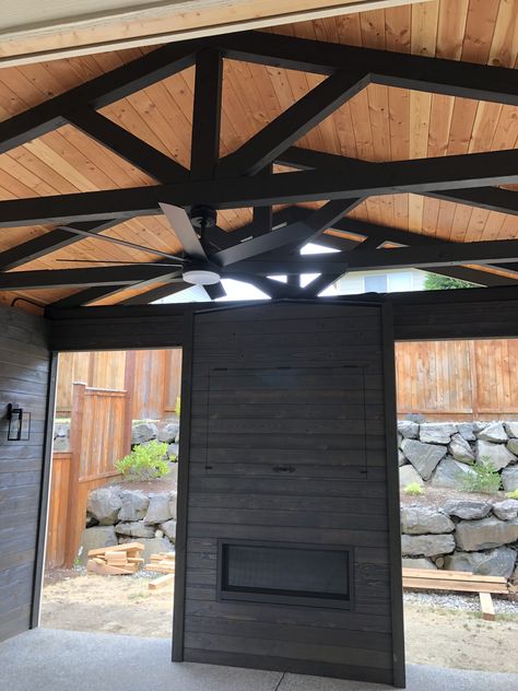 Tongue and groove ceiling with custom cut and made truss system, pre stained ship lap covering the fireplace and tv nooks. Outdoor Tv Entertainment Center, Outdoor Fireplace With Tv, Outdoor Covered Porch, Seasonal Campsite, Cabin Landscaping, Trail Ideas, Sunroom Remodel, Fireplace Patio, Carport Ideas