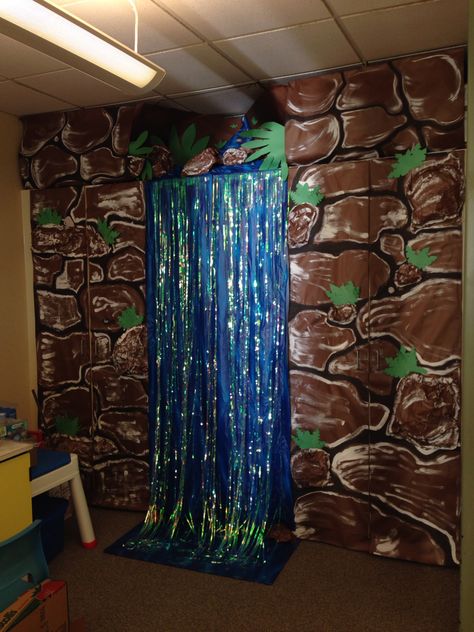 Classroom waterfall for rainforest theme Rainforest Classroom Transformation, Classroom Waterfall, Rainforest Theme Party, Rainforest Classroom, Enchanted Forest Book, Preschool Jungle, Jungle Rainforest, Rainforest Project, Forest Classroom