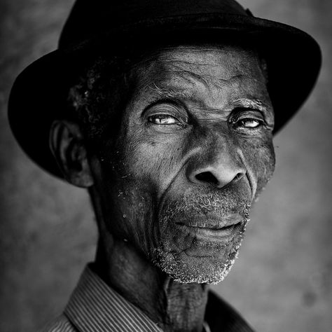 Black and White portrait of an old man with hat in a remote village near Kasanga, Lake Tanganyika, Tanzania.  Website: Dietmar Temps, photography Blog: Dietmar Temps, travel blog Old Man Portrait, Art Photography Portrait, Portrait Photography Men, Old Faces, Black And White Photograph, Face Photography, Face Expressions, Black And White Portraits, Male Portrait