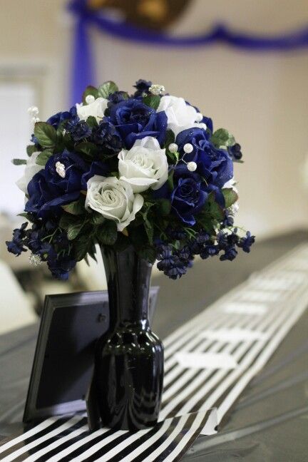 Blue And Black Floral Arrangements, Royal Blue Black And Silver Wedding Table Settings, Black And Blue Centerpieces, Midnight Blue Centerpieces, Black And Blue Party Decor, Black White And Royal Blue Wedding Decor, Black Blue White Wedding, Black And Blue Quinceanera Theme, Navy Blue Wedding Centerpieces