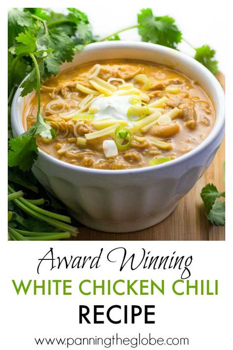 It's easy to cook a big pot of this award winning white chicken chili, and it's the absolute BEST! Tender chicken, chilies, white beans, spices and a few more goodies in this winning white chicken chili recipe! Top with sour cream, cheese, scallions, a drizzle of your favorite hot sauce. It's makes a lot of chili, but it freezes really well! #chicken #chili #recipe #ChickenChili Award Winning White Chicken Chili Recipe, Award Winning White Chicken Chili, White Chicken Chili Slow Cooker, White Chicken Chili Recipe, White Bean Chicken Chili, Chili Chili, White Chili Chicken Recipe, White Chili, Chicken Chili Recipe