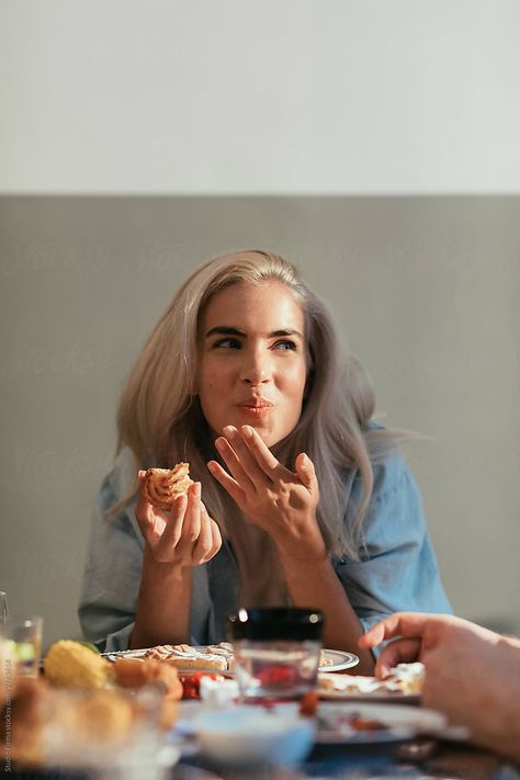 Portrait of a beautiful blond girl eating at a dinner party People Eating Dessert Photography, Family Dining Photography, People Sharing Food Photography, Happy Lifestyle Photography, People With Food Photography, Dinner Party Editorial, Home Cooking Photography, Food Photography With Model, Food Photography With People